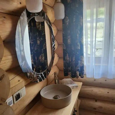 a bathroom with a sink in a log cabin at Dom z Bali Zawoja z widokiem na Babią Górę in Stryszawa