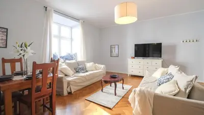 a bathroom with a sink and a toilet and a tub at Vintage apartments Floriańska street - By Hosty in Kraków