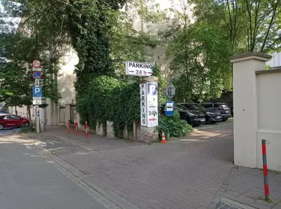 a street sign on the side of a street at A cozy apartment in the heart of the city in Kraków