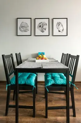 a dining room table with chairs and a bowl of fruit at Elegant apartment 5 minutes from Wawel Castle in Kraków