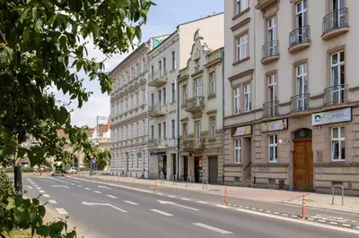 an empty street in a city with buildings at Dietla Apartament z Klimatyzacją i Balkonem w Centrum Krakowa by Noclegi Renters in Kraków