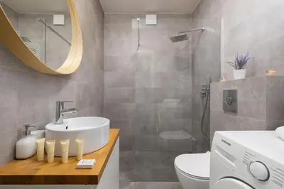a bathroom with a sink and a toilet and a shower at Dietla Apartament z Klimatyzacją i Balkonem w Centrum Krakowa by Noclegi Renters in Kraków