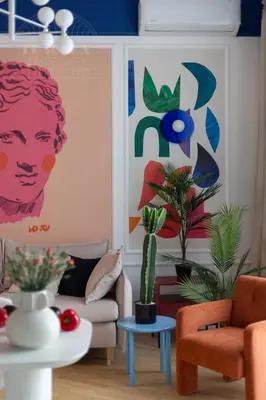 a living room with a couch and a cactus at Colorful 2-bed, 100sqm apartment in the heart of Kazimierz in Kraków