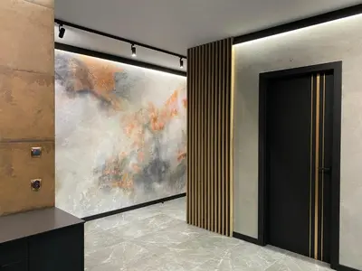a painting on the wall next to a door at Deluxe Industrial Apartment free Parking in Kraków