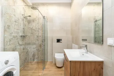 a bathroom with a toilet and a sink and a shower at Dietla ANTA Apartment in Kraków