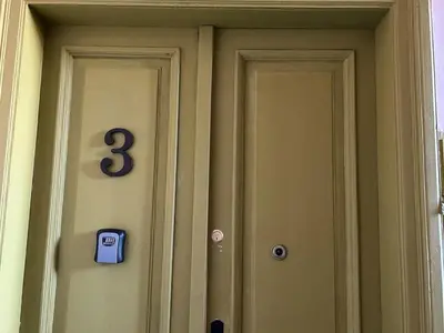 a front door of a house with a number three at Old Town - 2 bedrooms Sołtyka S3 in Kraków