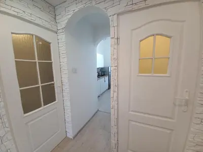 a white door in a room with a hallway at Old Town - 2 bedrooms Sołtyka S3 in Kraków