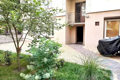 a garden in front of a building at Old Town Apt - Rzeszowska R6 in Kraków