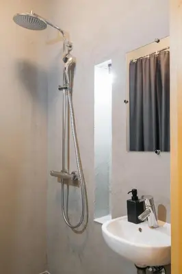 a bathroom with a shower and a sink at Native Apartments Krupnicza 7 in Kraków