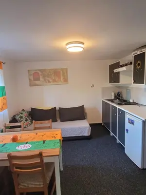 a small room with a couch and a table at Apartamencik Pod Krokusem 2 in Rabka
