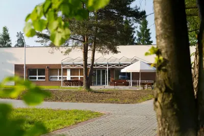 a building with a pavilion in a park at Hotel Dobczyce in Dobczyce