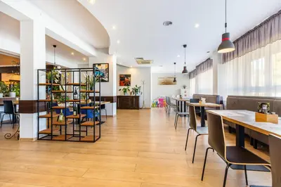 a dining room with tables and chairs in a restaurant at Hotel Dobczyce in Dobczyce