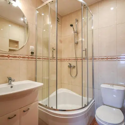 a bathroom with a shower and a toilet and a sink at Zajazd Pasja in Sławków