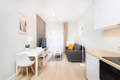 a kitchen and living room with a couch and a table at City of the Kings-Milford Sound in Kraków