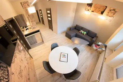an overhead view of a living room with a table and a couch at Yourplace Central Apartments in Kraków