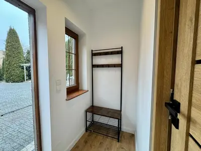 a bathroom with a shower and a toilet and a sink at Cozy Cottage in Oświęcim