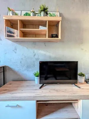 a wooden table with potted plants on top of it at Królowej Jadwigi 9 by Homeprime in Kraków