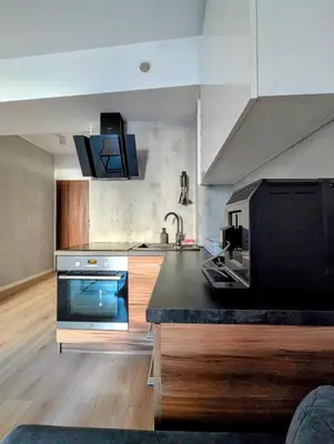 a kitchen with a stove and a counter top at Królowej Jadwigi 9 by Homeprime in Kraków