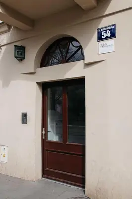 a door to a building with a sign above it at Saguaro Deluxe Apartment Old Town Cracow in Kraków
