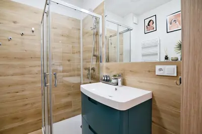 a bathroom with a sink and a shower at Green Vibe 11 Zator blisko Energylandii by Housine in Zator