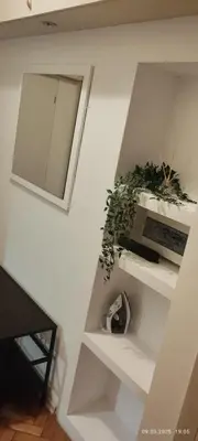 a kitchen with white cabinets and a sink at ALEX Topolowa in Kraków