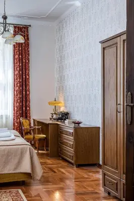 a bedroom with a bed and a desk in it at Best location to explore Krakow Spacious 105m2 in Kraków