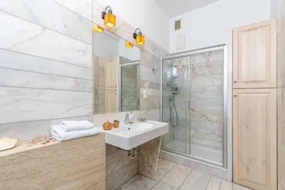 a bathroom with a sink and a shower at Best location to explore Krakow Spacious 105m2 in Kraków
