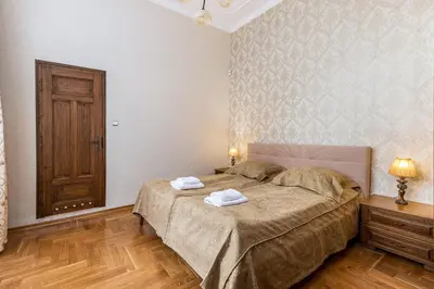 a bedroom with a bed with two towels on it at Best location to explore Krakow Spacious 105m2 in Kraków