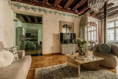 a living room with a couch and a table at Grodzka by Tyzenhauz in Kraków