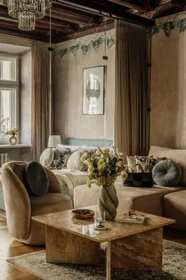a kitchen with white cabinets and a table in a room at Grodzka by Tyzenhauz in Kraków