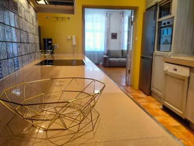 a kitchen with a glass bowl on a counter at Kings City - Central Apartment in Kraków