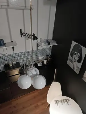 two white lights in a room with black walls at Cracow Fancy Brick #3 - Old Town in Kraków