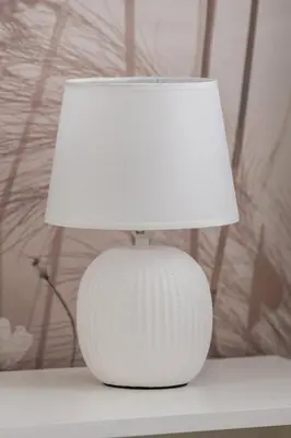 a white lamp sitting on top of a table at Jasny Apartament z Umeblowanym Balkonem w Krakowie Blisko Stawu by Noclegi Renters in Kraków