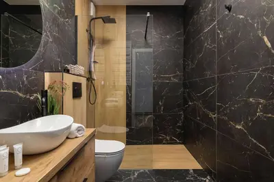 a bathroom with a sink and a shower at Jasny Apartament z Umeblowanym Balkonem w Krakowie Blisko Stawu by Noclegi Renters in Kraków