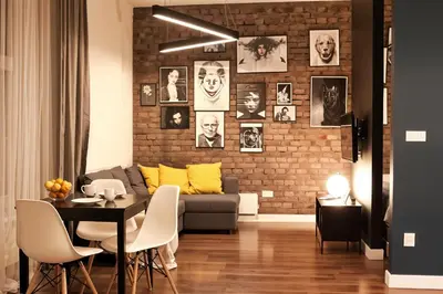 a living room with a couch and a table at Cracow Fancy Brick #5 - Old Town in Kraków
