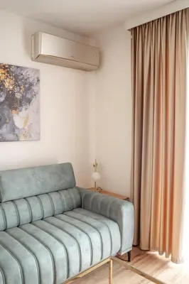 a living room with a couch and a window at Luna Et Sol Apartments in Rząska
