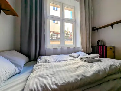 a bed in a bedroom with a window at Starowiślna 69 by Homeprime in Kraków