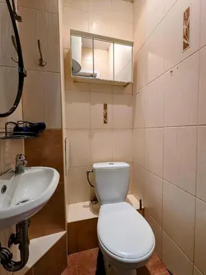 a bathroom with a toilet and a sink at Starowiślna 69 by Homeprime in Kraków