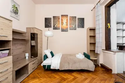 a kitchen with a sink and a counter top at Park Strzelecki Cosy Studio by BookingHost in Kraków