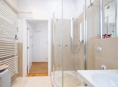 a bathroom with a shower and a sink at One Bedroom city center Krakow in Kraków