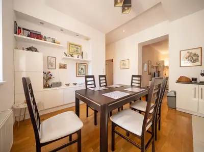 a kitchen and dining room with a table and chairs at One Bedroom city center Krakow in Kraków