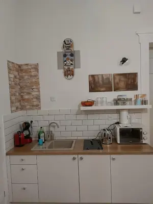 a kitchen with a sink and a microwave at Cracow Route #1 - Old Town in Kraków