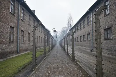 an empty alley between two brick buildings at Cracow Route #1 - Old Town in Kraków