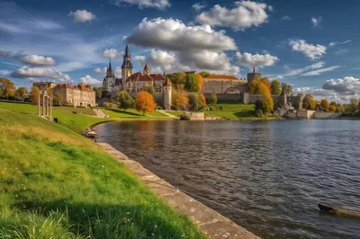 a castle on the shore of a lake with trees at Cracow Route #3 - Old Town in Kraków