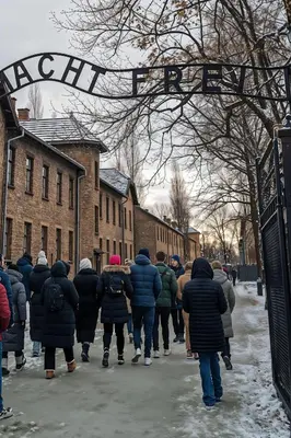 a group of people walking down a street at Cracow Route #3 - Old Town in Kraków