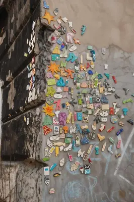 a pile of toys on the ground next to a wall at Cracow Route #4 - Old Town in Kraków