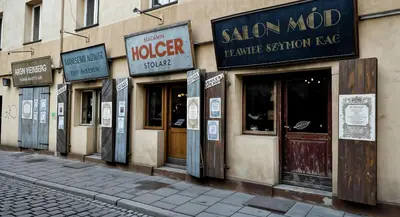a row of signs on the side of a building at Cracow Vistula Boulevard #3 - Old Town in Kraków