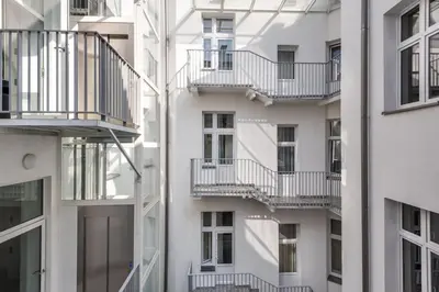 an apartment building with balconies on the side of it at Old Town Apt Bosacka Str - B10 in Kraków