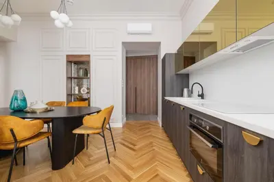 a kitchen with a black table and yellow chairs at AC - Sauna - 3 Bedroom Ap - Starowiślna 29 in Kraków