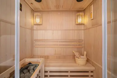 a sauna with a bench and a basket in it at AC - Sauna - 3 Bedroom Ap - Starowiślna 29 in Kraków